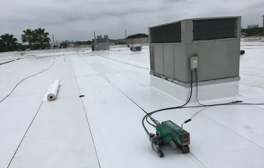 Commercial roofing in Pompano Beach FL on a low-slope warehouse roof