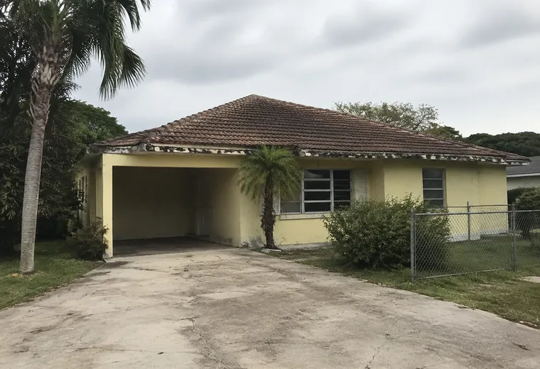 Before: failed barrel tile roof on a Cresthaven house in Pompano Beach FL