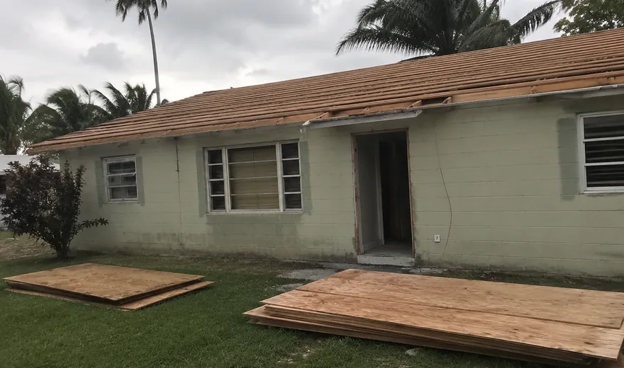 Roofing in Oakland Park FL, deck exposed on a 1950s ranch house