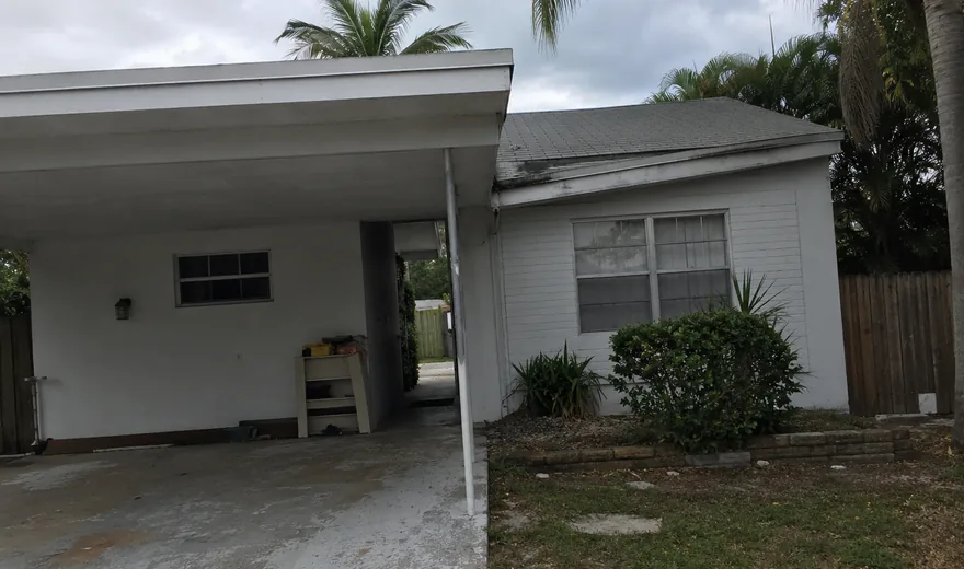Roofing in Wilton Manors FL on a mid-century flat and pitched roof